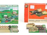 a toy train set with a box and a train on the tracks