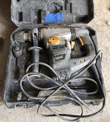 a tool in a case that is sitting on the floor
