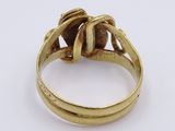 an image of a gold ring with a brown stone in it