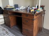 a desk with a laptop on it in a room