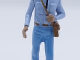 a figurine of a man with a pink turban on his head