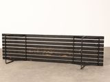 an image of a black bench in a room