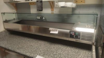 a counter top with a glass display case on it