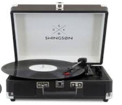 une image représentant une valise contenant un tourne-disque
