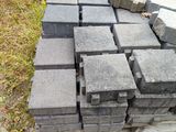 a pile of bricks sitting on the ground in the grass