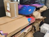 a pile of boxes and boxes sitting on top of a desk