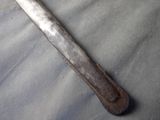 a very old hammer that is laying on a table