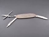 a swiss army knife with two knives attached to it
