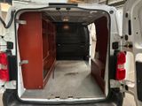 a white van that is parked in a garage