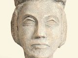sculpture of a woman ' s head with braids on her hair
