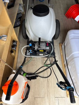 a small machine that is sitting on the floor next to a bed
