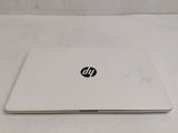 hp laptop computer sitting on a white surface on a white surface