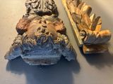 two pieces of art that are on a table