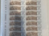a picture of a picture of a sheet of stamps on a table