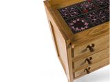 a wooden table with a glass top and a drawer with drawers