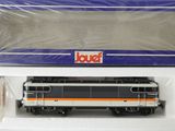 une image représentant un petit train se trouve dans une boîte en plastique