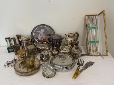 a table with a lot of silver items on it