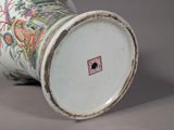 a white vase with a floral design on it