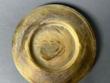 a wooden bowl that is sitting on a table