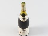 a bottle of wine that is sitting on a table