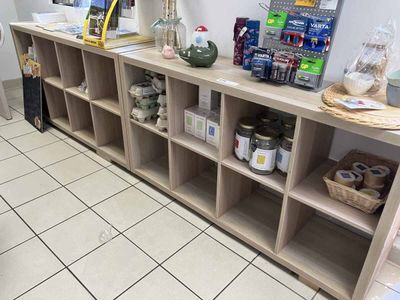 a shelf with various items on it in a store