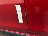 a sticker on the door of a red car