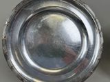 a silver plate that is sitting on a table