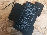 a close up of a black box on top of a wooden floor
