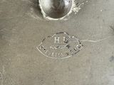 a close up of a piece of metal with a hole in it