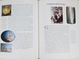 an open book with pictures of vases on it