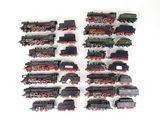 a lot of toy trains that are on the table