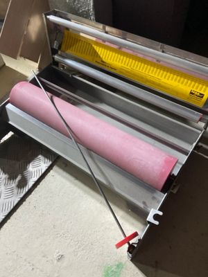 a machine that is sitting on the floor next to a box