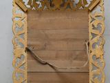 an image of a wooden frame with an ornate design on it