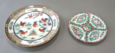 pair of chinese plates with birds and flowers on them on a table