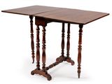 a small table with two leaves on the top and two legs
