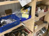 a shelf full of assorted items in a garage