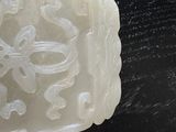 someone is holding a soap bar with a flower design on it