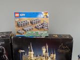 two boxes of legos sitting on a table