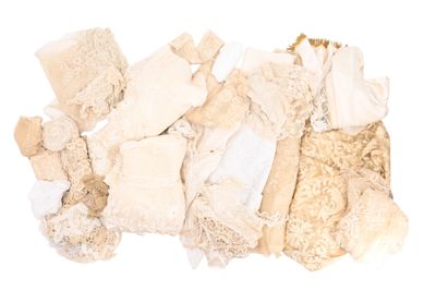 a pile of clothing that is on a white surface
