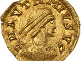 une pièce d'or sur laquelle figure une femme coiffée d'une coiffe