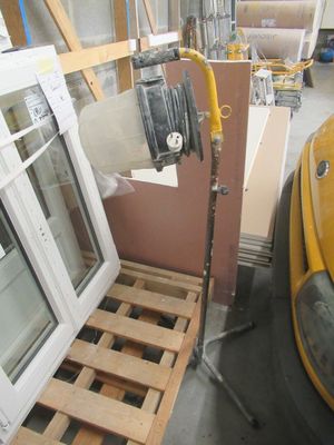 a yellow truck that is parked in a garage