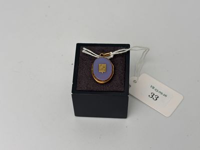 an image of a necklace in a box with a tag on it