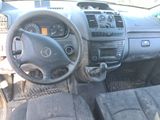 a dashboard of a car with a steering wheel and dashboard controls