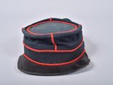 an image of a blue hat with red trims on a white surface