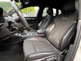the interior of a car with two seats and a center console