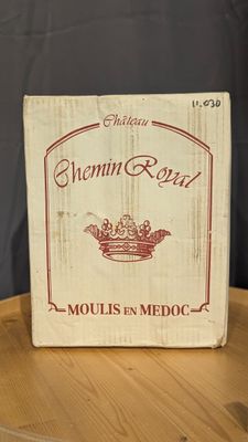 a wooden box with a label on it sitting on a table