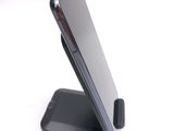 a cell phone that is sitting on top of a stand