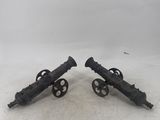pair of antique cast iron cannon wheels on wheels