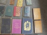 many books that are sitting on the floor together