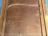 a picture of an old wooden picture frame on the floor